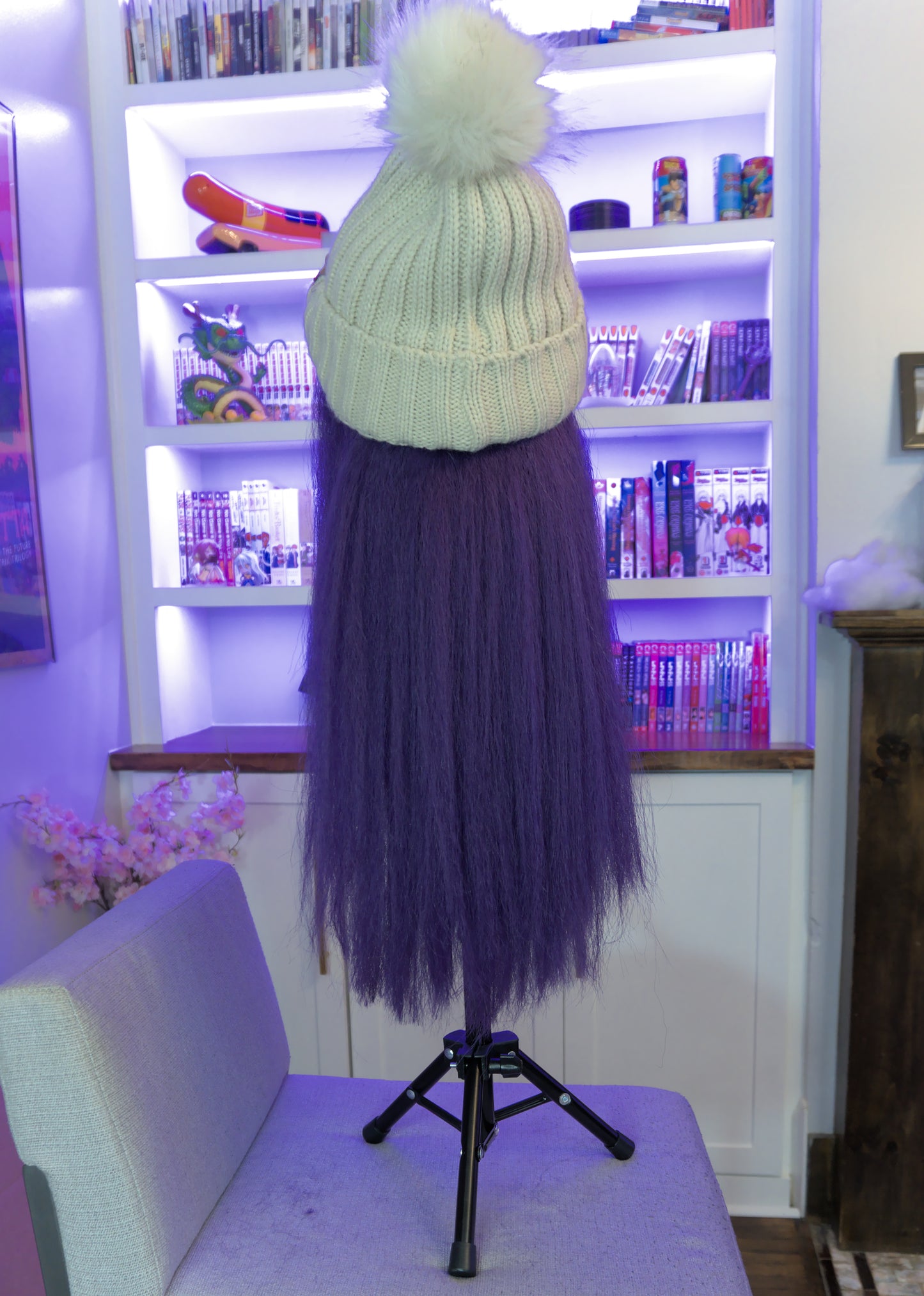 Back of purple craze hat wig with oatmeal hat and straight bang